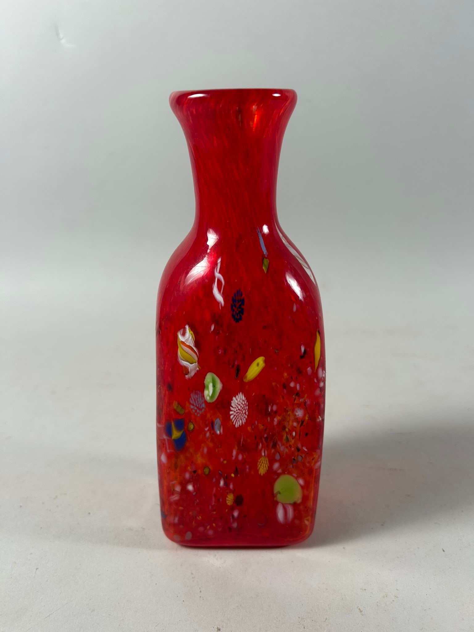 Murano Glass Vase: Colorful Abstract Pattern Embedded Within Glass. Red Murano Glass Vase. Illegibly Signed. 8"h x 3"w x 2"d