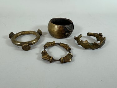 Lot of 4 - West African Brass Armlets PROVENANCE: From the estate of Professor Philip Gould, New