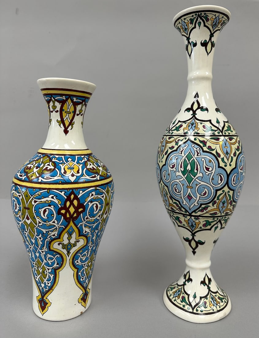 Pair of 2 - Hand-Painted Sornaga Pottery Vases.: Hand painted Persian style vases; one has a wider base and a shorter neck, the other one has a narrower base with a pedestal and a longer, thinner neck. Decorated floral and geometric patterns in blue