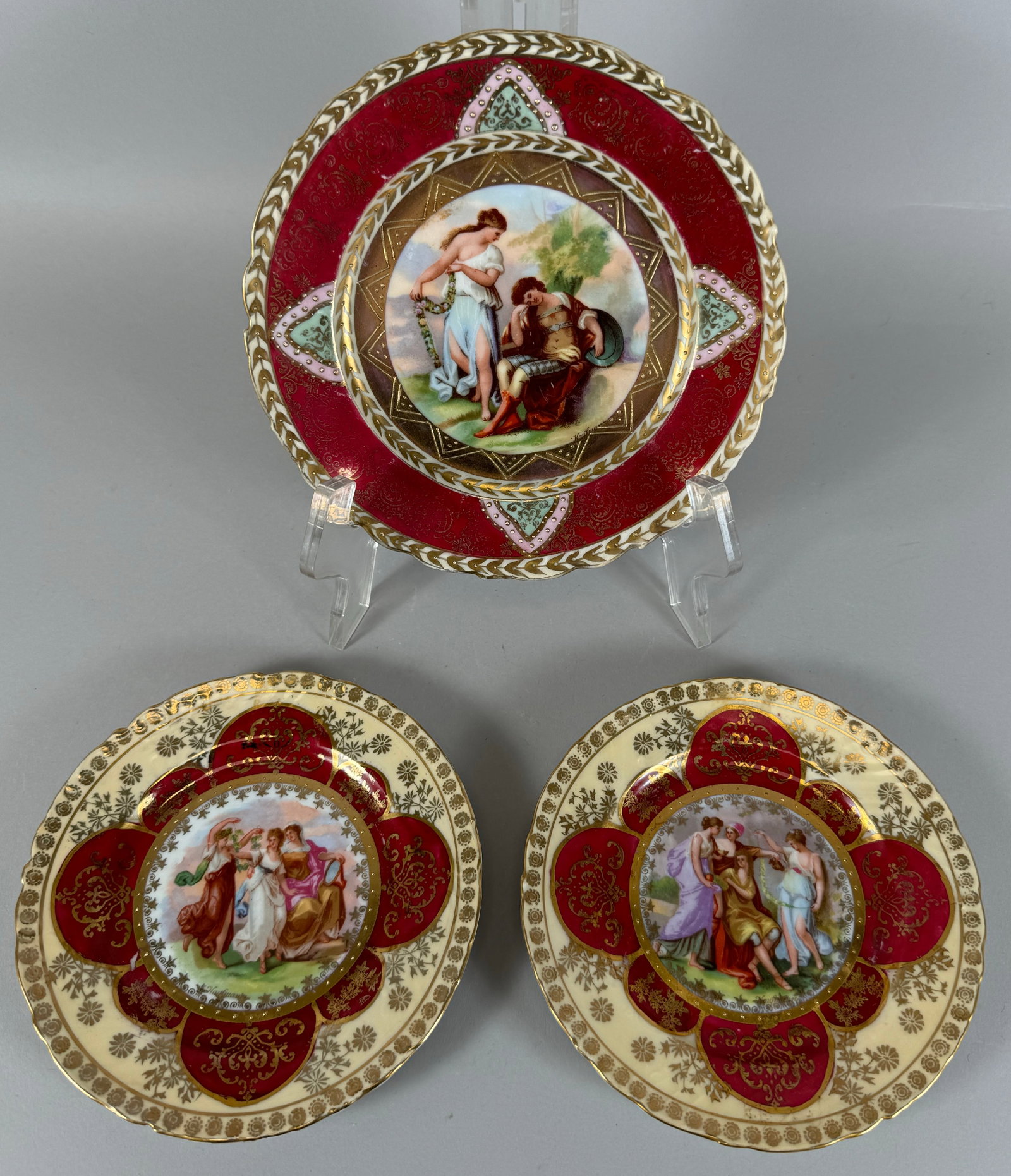 Set of 3 - Vintage Royal Austria Cabinet Plates Signed Kaufmann Gold Trim Burgandy Border: Vintage Royal Austria cabinet plates. Signed Kaufmann. Acrylic plate display stands are not included. D: Largest 7"d, smallest 6"d.
