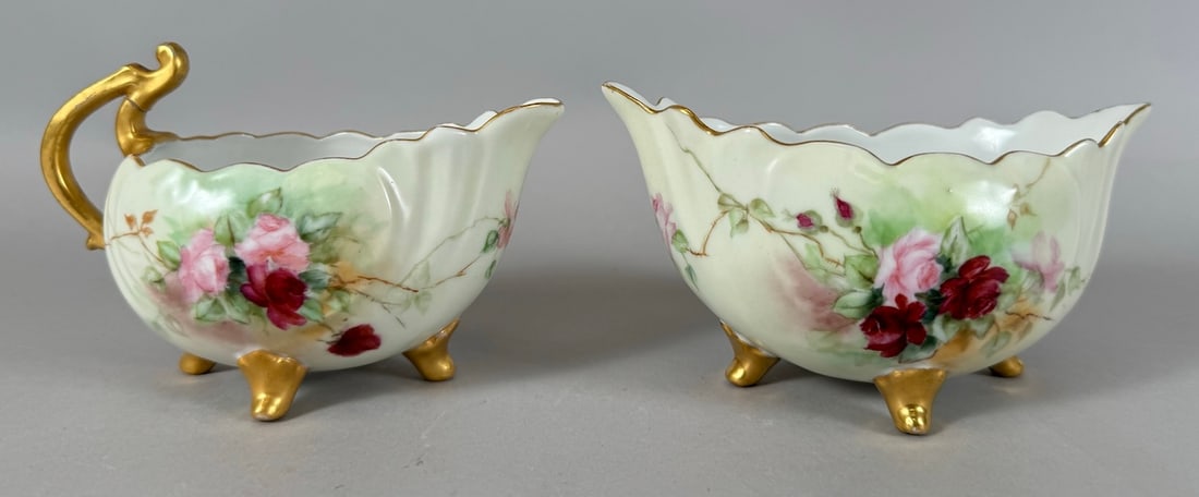 Set of 2 - Vienna Crown Hand Painted & Gilded Floral Creamer & Sugar Bowl: Vienna Crown Hand Painted & Gilded Floral Creamer & Sugar Bowl. Footed dishes. D:Largest 5.75"l, 3.75"w x 2.25"d, smallest 4"l x 3"w x 2.25"d.