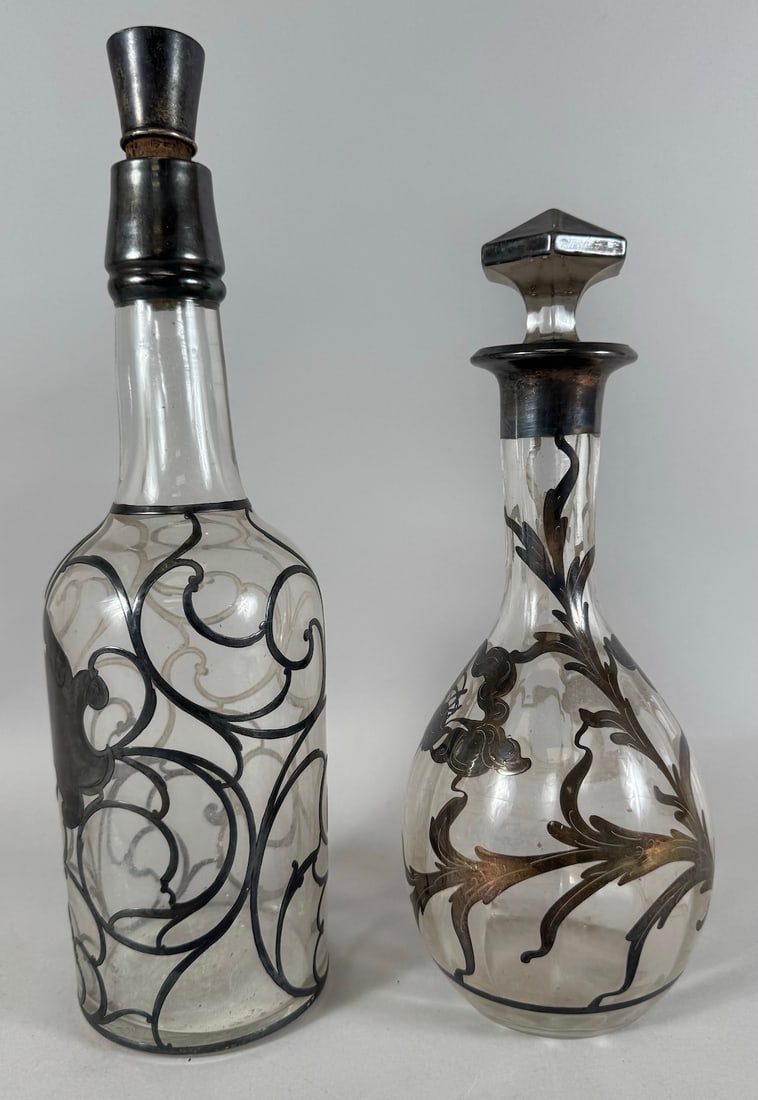 Lot of 2 - Vintage Art Nouveau Sterling Silver Overlay Decanters: Vintage Art Nouveau Sterling Silver Overlay Decanters. D: Largest 12.5"h x 3.5"d, smallest 10.5"h x 3"d.