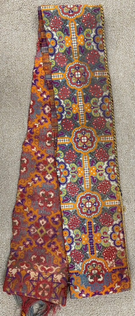 Vintage Handwoven Moroccan Belt: Vintage handwoven Moroccan belt with tied tassels. It is a multicolored with repeating geometric and floral motifs. From Morocco Nort region, Djebela Tetouin. D: 5.50" W x 100" L.