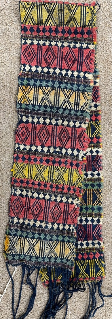 Vintage Mindanao-Sarong Band: Mindanao Sarong band which was handwoven by Mindanao and Sulu people from Philippines. Naturally dyed in red, blue and yellow with dark blue fringes. D: 4" W x 28" L.