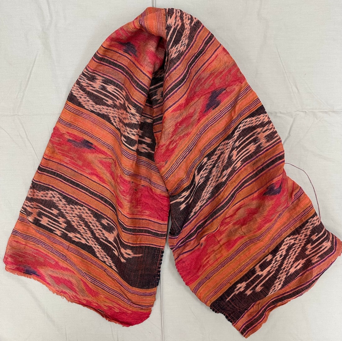 Handwoven Vintage Thai Textile: Handwoven textile from Thailand-Bangkok with silk thread and natural dyed. Has design in orange, red, black and intricates stylized animal and plant motifs. D: 24" L x 50" W.