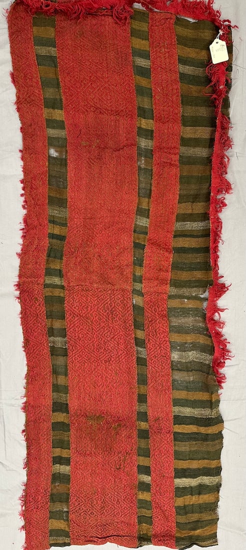 Handwoven Fragment From Peru-Chile: Handwoven textile fragment from the Chiribaya culture in southern Peru and Northern Chile. Woven camelid fiber. D: 41" x 15".