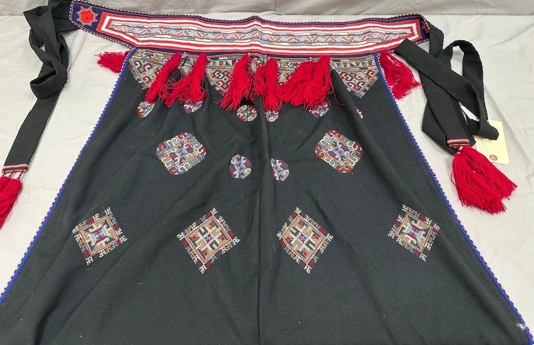 Vintage Yao Baby Wrap Carrier: Vintage Yao embroidered baby wrap carrier from China. Red tassels adorn the hemline with embroidered detailing on cotton black textile. D: 33" W x 31" L.
