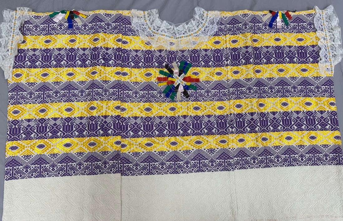 Traditional Guatemalan Wedding Huipil: Traditional Guatemalan wedding huipil with laces on the arms and neck. Had silk embroidery motifs that represents Guatemalan culture. D: 37" W x 32" L.