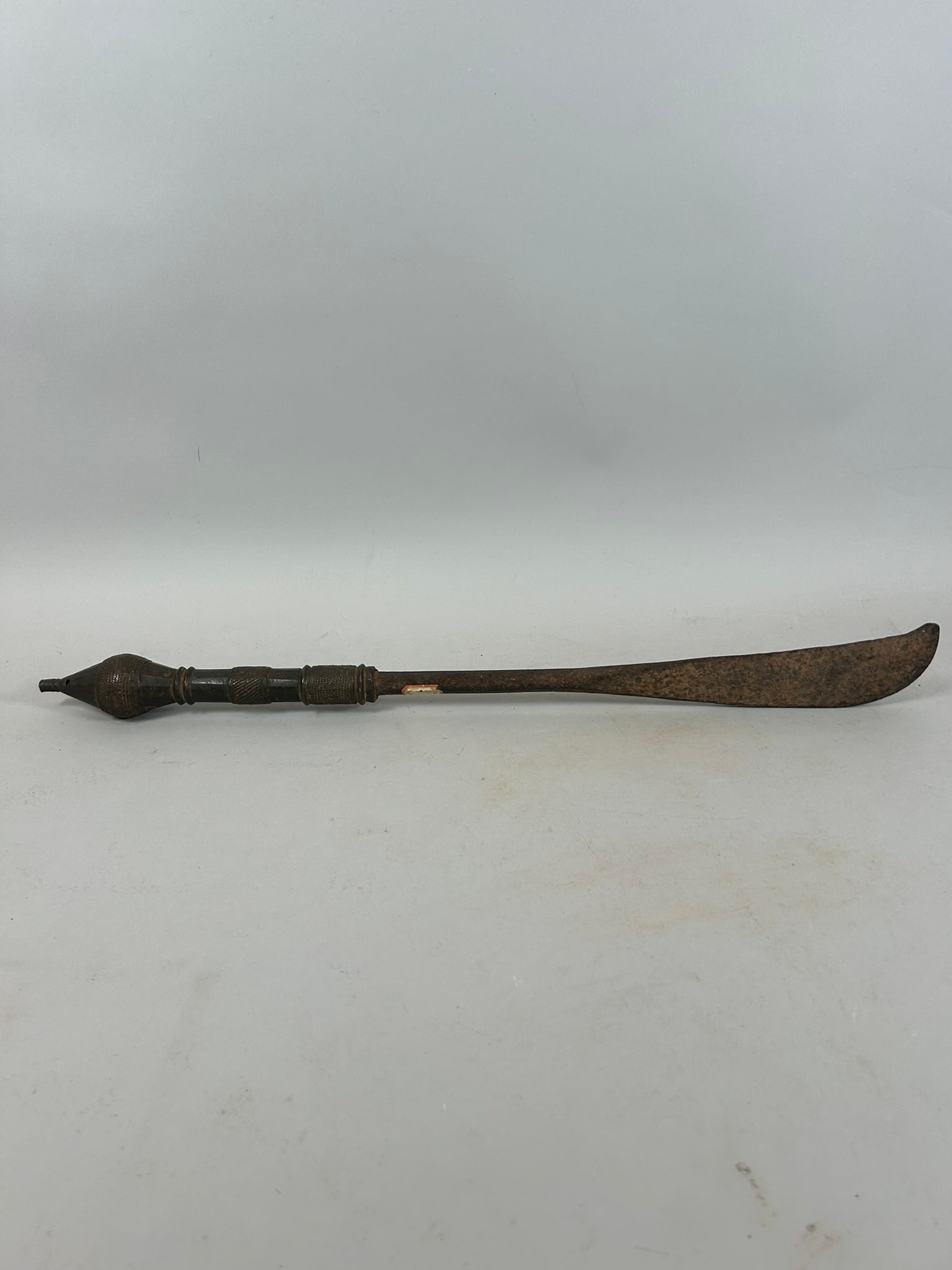 Yoruba Ceremonial Blade: An iron ceremonial blade with copper alloy handle, Yoruba peoples, Nigeria, West Africa. Approximate dimensions: 23" long