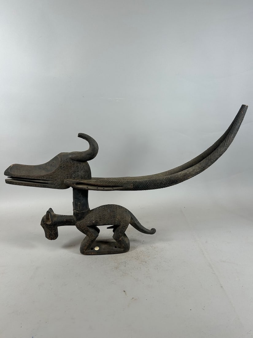 Chiwara Headdress, Mali: A carved wood headdress, chiwara or chiwara style, Bamana peoples, Mali, West Africa. Approximate dimensions: 13.5" x 26.5" x 3.5"