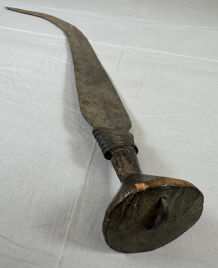 Wrought Iron Sword, Democratic Republic of the Congo: Wrought iron sword, wood handle with wrapped metal ribbon, Democratic Republic of the Congo. Approx. 28" x 3" x 3".