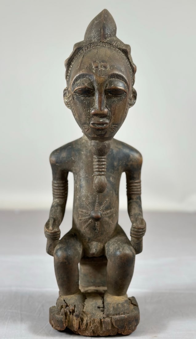 Baoule Figure, Ivory Coast: A carved wood figure, Ivory Coast, West Africa. Approx. 19" x 6" x 6"