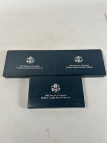Three (3) 1995 Special Olympics World Games Silver Dollars