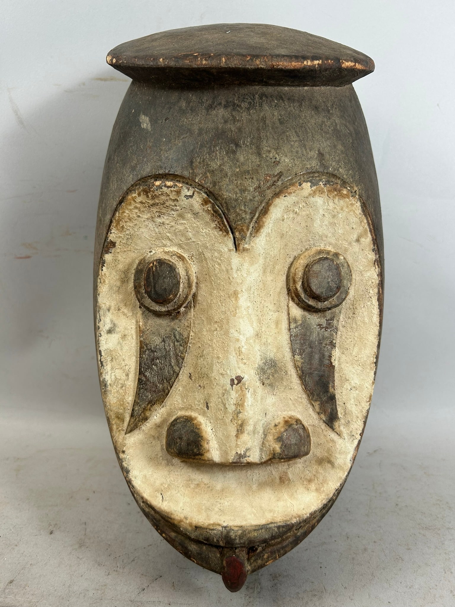 West African Wooden Carved Mask: West African Wooden Carved Mask. 14"h x 8"w x 5"l