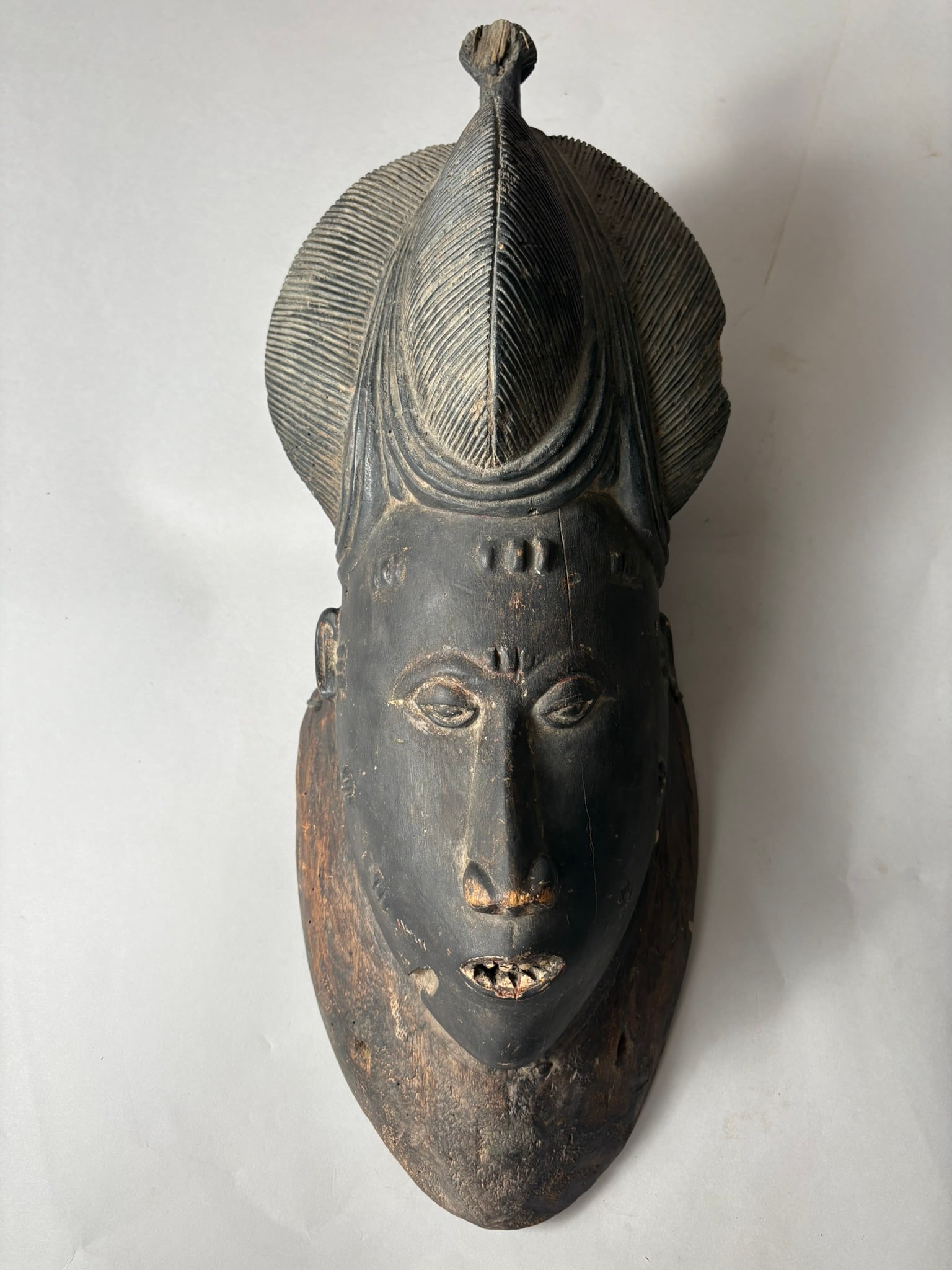 Ivory Coast Baule Carved Wooden Mask: Ivory Coast Baule Carved Wooden Mask. D:18"h x 7"w x 7"l