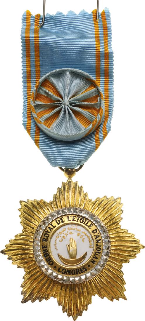 ROYAL ORDER OF THE STAR OF ANJOUAN: Officer's Cross, 4th Class, instituted in 1874. Breast Badge, 56 mm, gilt Bronze, maker’s mark, central medallion gilt, enameled, original suspension ring and ribbon with rosette. Mint state! I