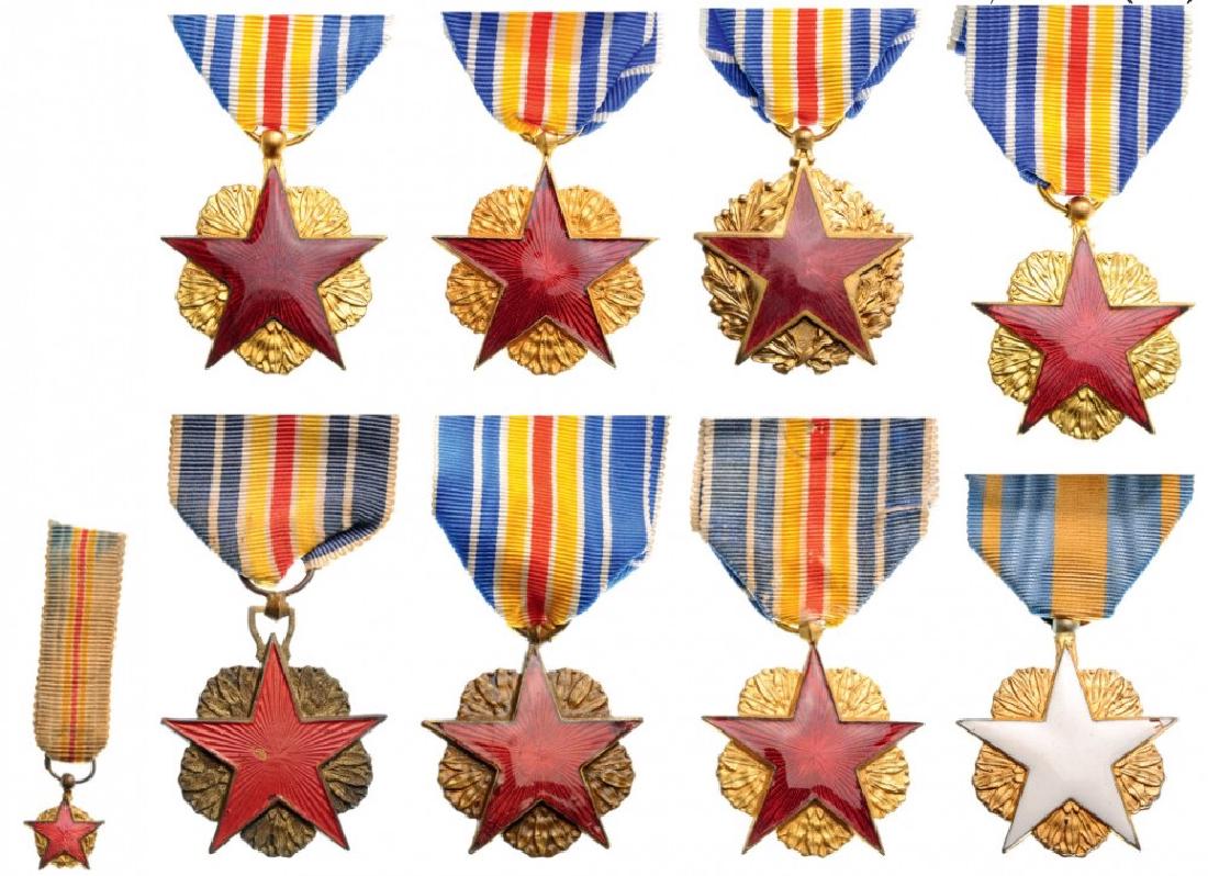 Lot of 9 Wounded Medals: Military Model (Red Star), (8), Civilian Model (White Star), instituted in 1916. Breast Badges, gilt bronze, different sizes, enameled, original suspension rings and ribbons. (9) I