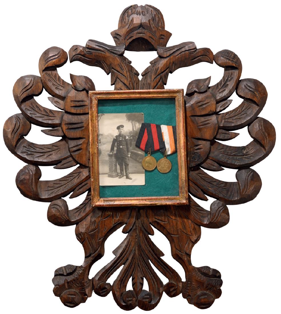 Big sculptured eagle shaped wooden panel containing in (1 of 2)