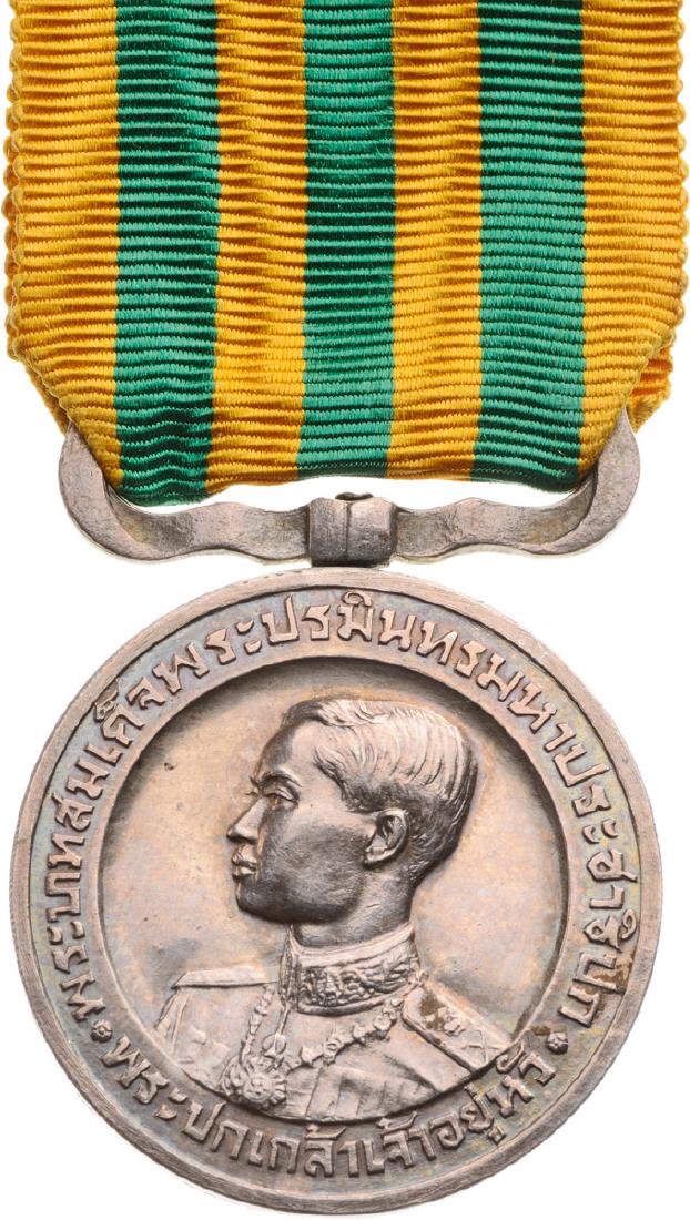 King Rama VII Coronation Medal, instituted in 1925: Breast Badge, Silver, 31 mm, original suspension ring and original ribbon. Perfect condition! I