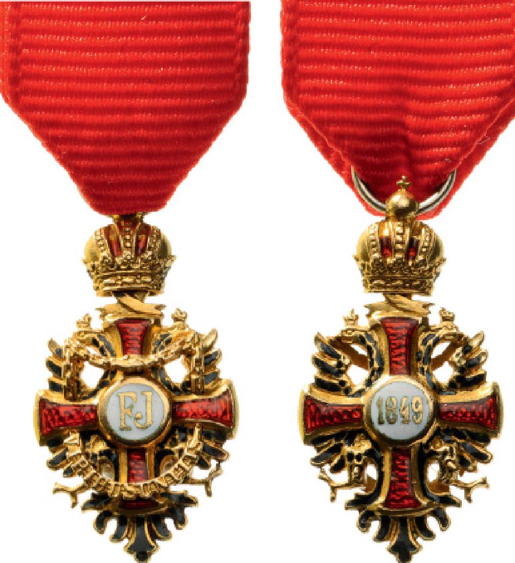 ORDER OF FRANZ JOSEF: Knightâ€™s Cross Half Size. Breast Badge, GOLD, 23 mm, enameled, original suspension ring and ribbon. I 77
