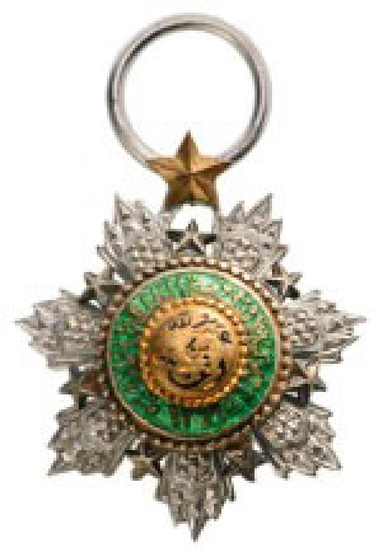 ORDER OF THE STAR: Officer's Cross Miniature, 4 th Class, instituted in 1949. Breast Badge, 21 x 18 mm, silvered Metal, maker's mark "Arthus Bertrand, Paris", with original ring. Scarce! I R! 1950
