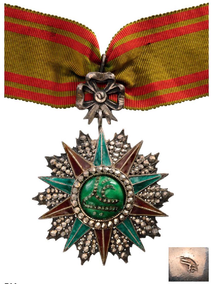 ORDER OF NISHAN EL IFTIKHAR: Commanderâ€™s Cross, 3rd Class, Ali Bey (1882â€“1902). Breast Badge, 85x63 mm, silver, partially enameled, Arabic hallmark, Tunisian manufacture, original neck ribbon. I 3086