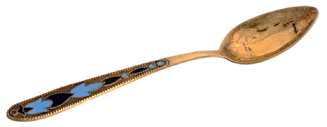 Silver gilt and enamel tea spoon.: Bowl of the spoon in form of pear, Spatula decorated with twocolored enameled geometrical motives, soviet period, 12 cm long, weight 14 g, "87.5" standard guarantee (silver gilt standard), kokoshnik (