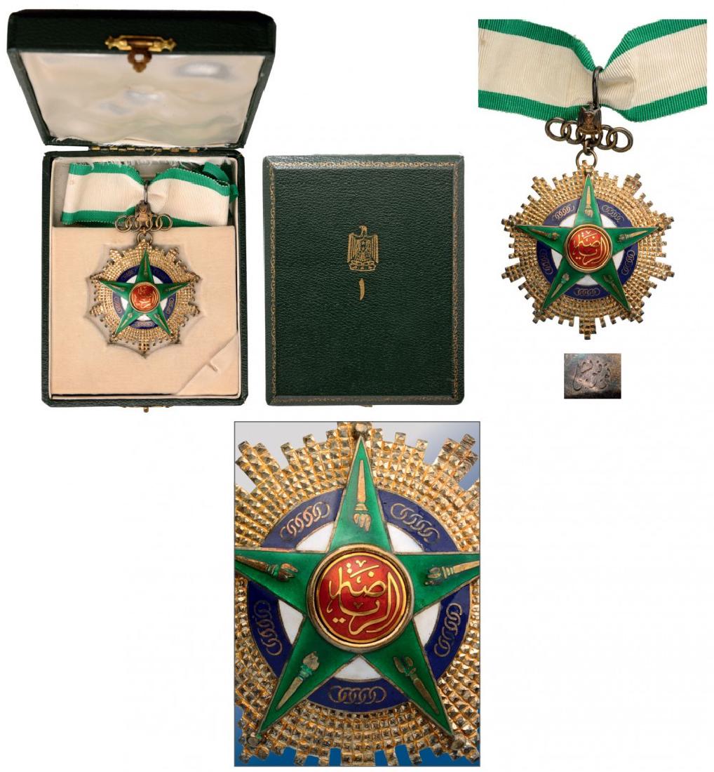 ORDER OF SPORTS: Commander's Cross, 1st Class. Neck Badge, 69 mm, gilt Silver, enameled, original suspension device with Egyptian coat of arms, in original case of issue with golden weapon on the lid. Extremely fine c