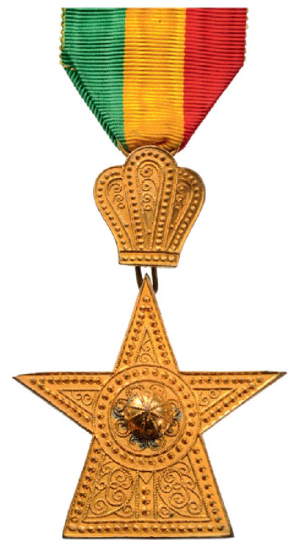 ORDER OF THE STAR OF ETHIOPIA: Knightâ€™s Cross, 5th Class, instituted in 1884. Breast Badge, gilt Bronze, 53x55 mm, makerâ€™s mark of "B.A. Sevadjian", original suspension ring and ribbon. I