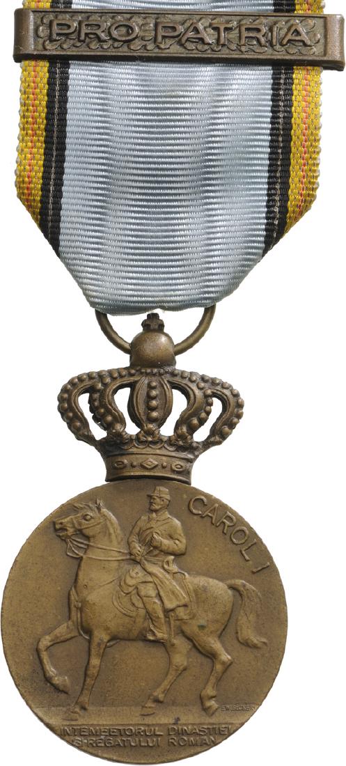 The Centennial Medal , instituted on 5th of May, 1939: Breast Badge, 54x35 mm, Bronze, on obverse the King on horseback, on reverse the years 1839â€“1939, with original ring, ribbon and bar "Pro Patria", awarded for the celebration of the 100th Anniv