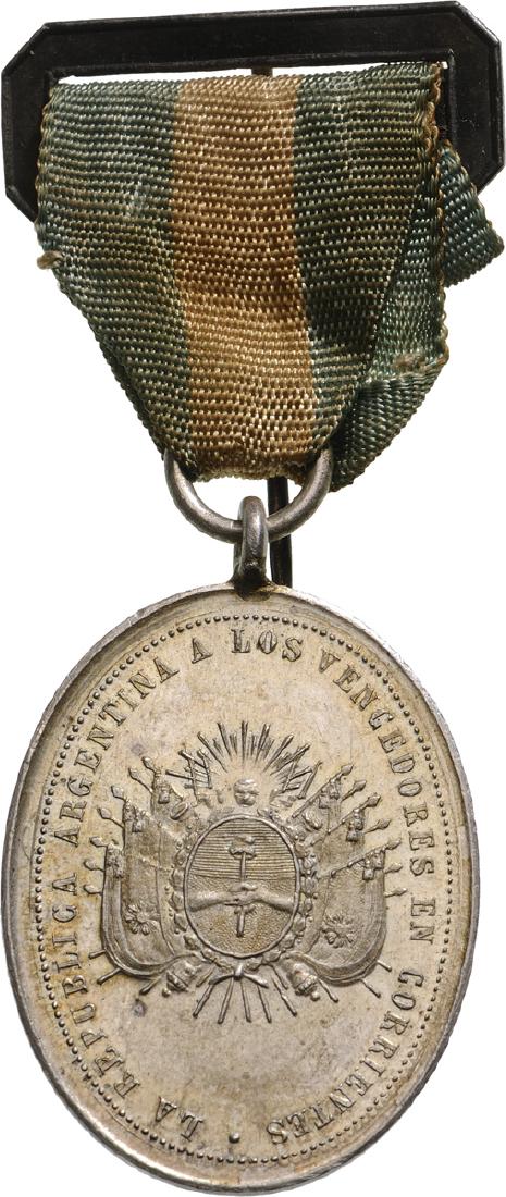Medal for the winners of the Corrientes battle for: Breast Badge, 44x32 mm, Silver, original suspension ring and ribbon. Awarded to the allied forces (Argentine and Brazilian troops) commanded by Argentinian General Wenceslao Paunero who reoccupied the