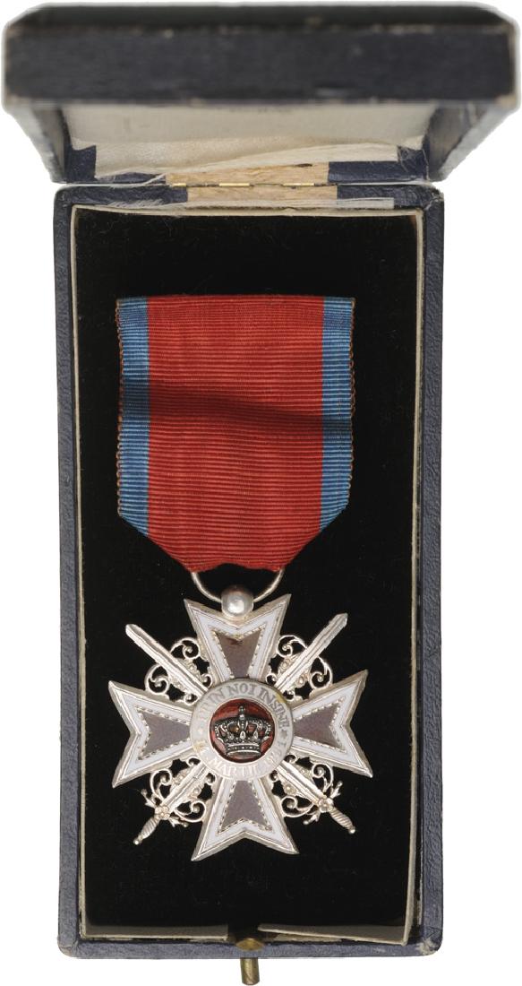 ORDER OF THE CROWN OF ROMANIA, 1883: Knight 's Cross, 1st Model, Military. Breast Badge, 42 mm, Silver, both sides enameled, original ring and military virtue ribbon, in case of issue by "Lemaitre - Paris" with monogram of King Ferdinand