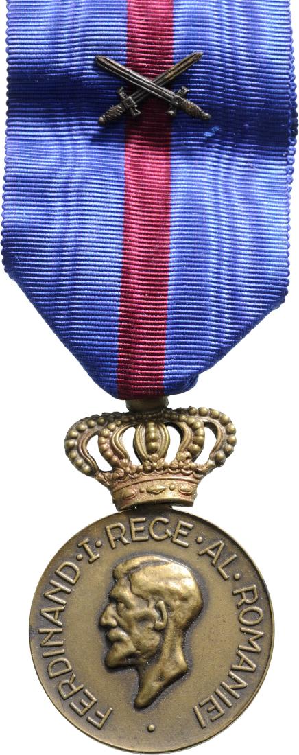 Medal of Ferdinand I, instituted on 10th of May 1929 by: Breast Badge, 31 mm, Bronze, on obverse King Ferdinand I, "small head", on reverse the dates of reign "1914-1927", original ring and ribbon with small bronze swords. I