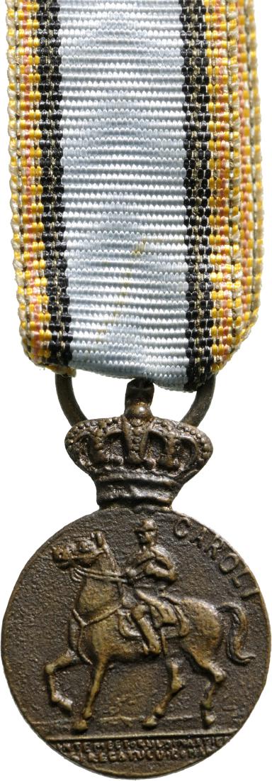 The Centennial Medal Miniature, instituted on 5th of: Breast Badge, 19x13 mm, Bronze, on obverse the King on horseback, on reverse the years "1839-1939", with original ring and ribbon, for the celebration of the 100th Anniversary of the birth of King Car