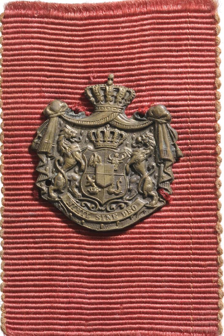 Carol I - Royal Weapon: Breast Badge, 65x 42 mm, Bronze, attached to red ribbon. I