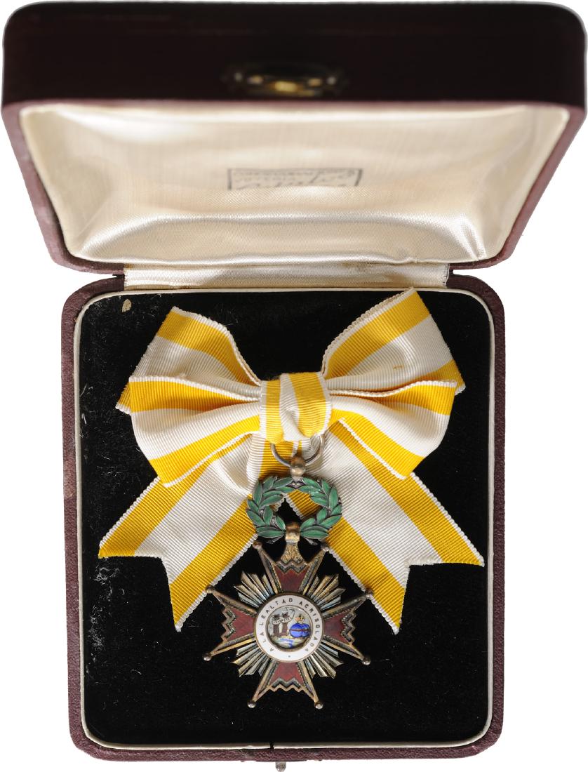 ORDER OF ISABELLA THE CATHOLIC: Knight`s Cross for Ladies, 5th Class, instituted in 1815. Breast Badge, 68x45 mm, gilt Silver, both sides enameled, both central medallions gilt, enameled, original laurel wreath suspension device and