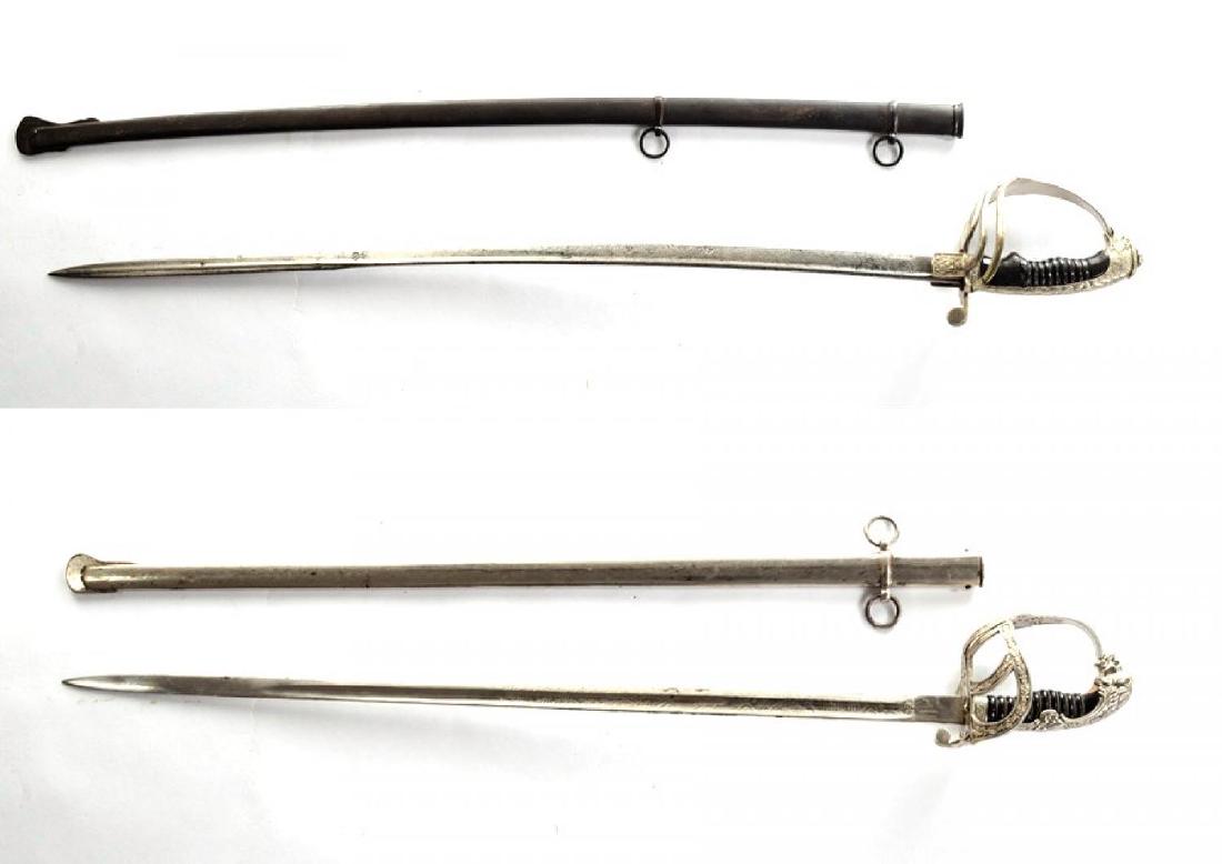 Lot of 2 Army Officerâ€™s Parade Sword: King Charles I sword, with scabbard. Handle with eagleâ€™s head, wood pommel broken, nickel plated guard, blade engraved with King Charles I cipher and Romanian Coat of Arms, oxidized