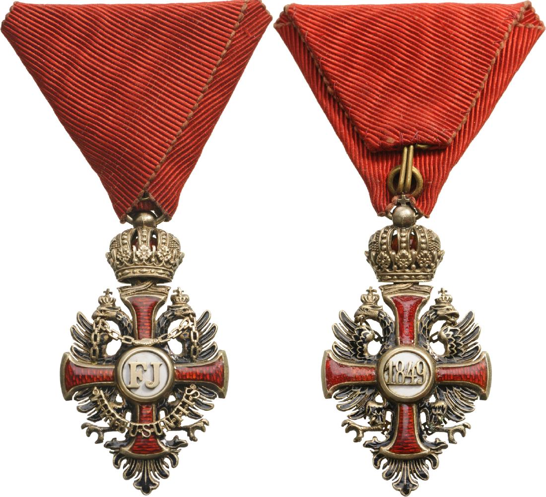 ORDER OF FRANZ JOSEPH: Knight’s Cross, instituted in 1849. Breast Badge, 58x32 mm, Silver gilt, enameled, maker’s mark “G.A.S.”, hinged reverse centre medallion, original red triangular ribbon. I-