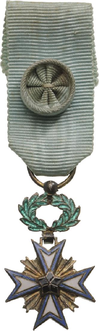 ORDER OF THE BLACK STAR: Miniature, instituted in 1889. Breast Badge, 24x14 mm, gilt Silver, both sides enameled, original suspension ring and ribbon with rosette. I