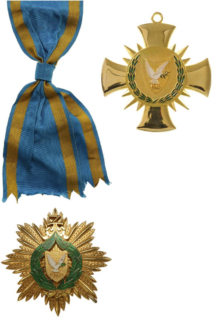 ORDER OF MERIT OF THE REPUBLIC OF CYPRUS: Grand Cross Set, 1st Class, instituted in 1991. Sash Badge, 78x62 mm, gilt Bronze, original suspension ring and complete long sash for the order of Makarios. Breast Star, 87 mm, gilt Bronze, enameled 
