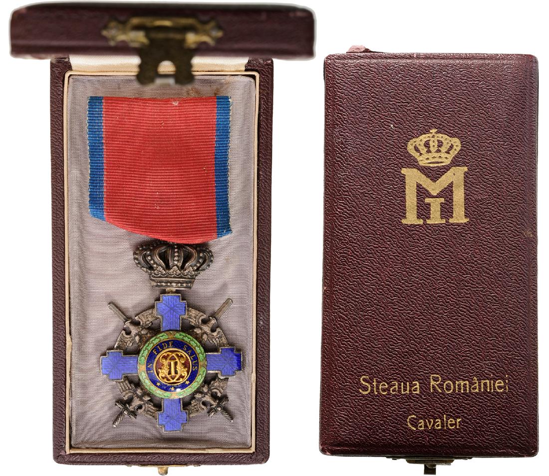 ORDER OF THE STAR OF ROMANIA, 1864: Knight's Cross, 2nd Model Military. Breast Badge, 63x40 mm, Bronze silvered, both sides enameled original suspension ring and military virtue ribbon in original case of issue with cypher of King Micha