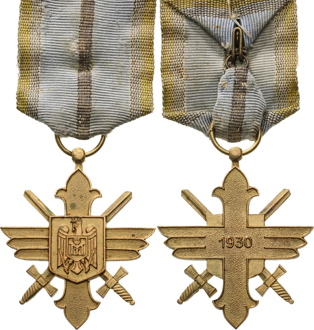 ORDER OF THE AERONAUTICAL VIRTUE, 1930: Gold Cross, 2nd Model with cipher of King Michael I, for Military, 1940. Breast Badge, 50x43 mm, gilt Bronze, original suspension ring and ribbon. I-
