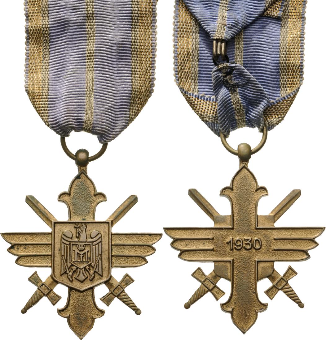 ORDER OF THE AERONAUTICAL VIRTUE, 1930: Gold Cross, 2nd Model with cipher of King Michael I, for Military, 1940. Breast Badge, 50x43 mm, gilt Bronze, original suspension ring and ribbon. II