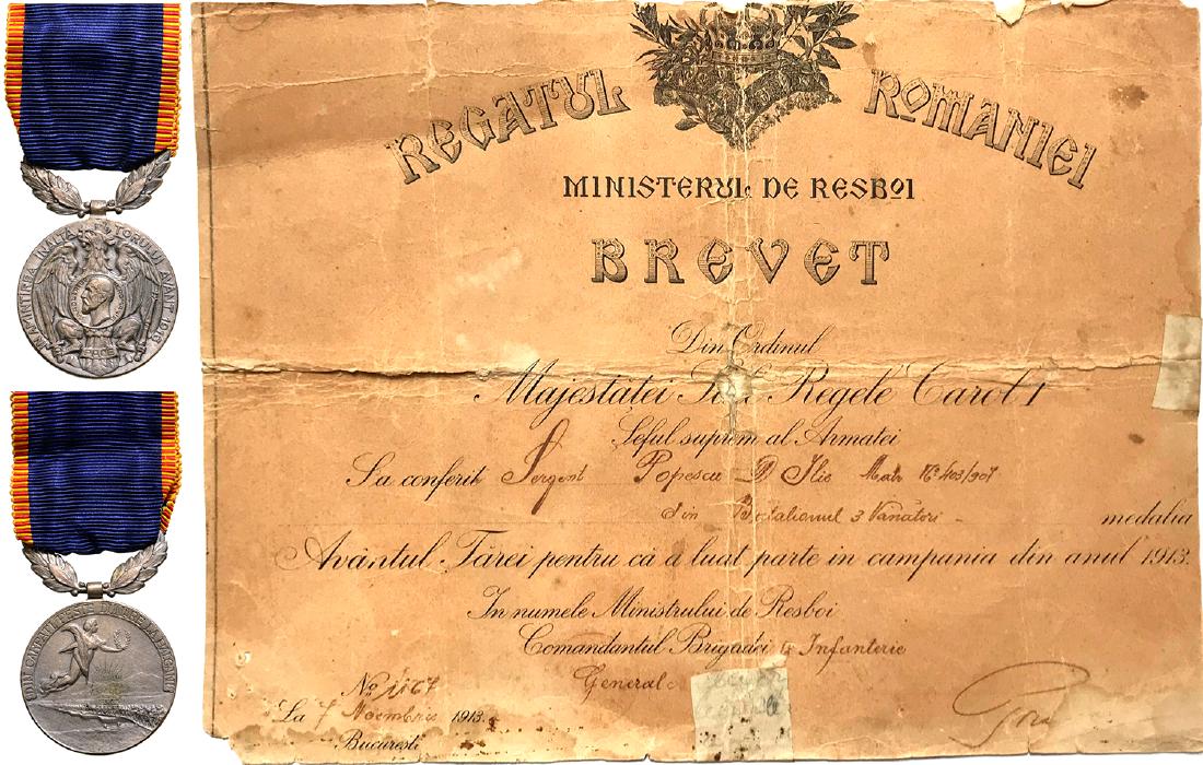 Country 's Upsurge Medal, 1913, to a Romanian 3rd: ROMANIA, Breast Badge, 33 mm, Bronze silvered, maker's mark "S", original ring and ribbon, together with awarding document, dated 07.11.1913. I/II