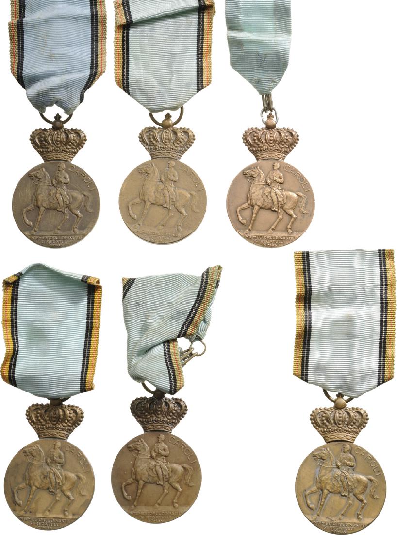 Lot of 9. The Centennial Medal, instituted on 5th of: ROMANIA, Breast Badges, 55x35 mm, Bronze, on obverse the King on horseback, on reverse the years "1839-1939", with original ring and ribbon, for the celebration of the 100th Anniversary of the birth o