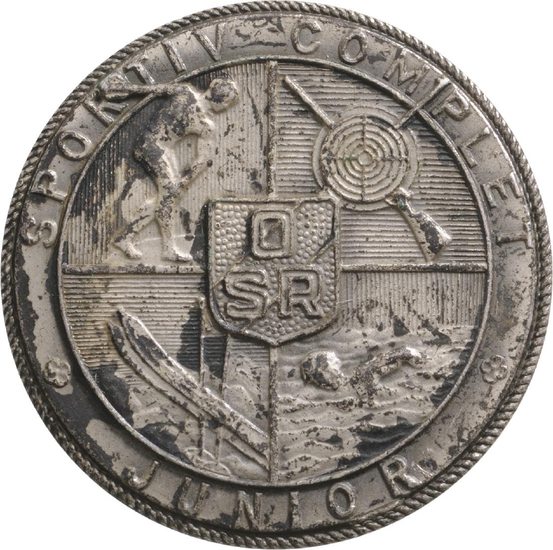 Romanian Sportsman Badge (Complete Sportsman) -: ROMANIA, Breast Badge, 29 mm, silvered Bronze, maker's mark "Monetaria Nationala", vertical pin on the back. M.S.B.R 715. II