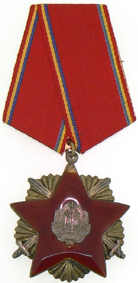 RPR - ORDER FOR DEFENCE OF THE FATHERLAND, instituted: ROMANIA - POPULAR REPUBLIC, 1948-1965, 3rd Class, 1st Model. Breast Badge, 46 mm, Silver partially gilt, numered "801 - C", original suspension ring and triangular ribbon. Awarded to the military and 