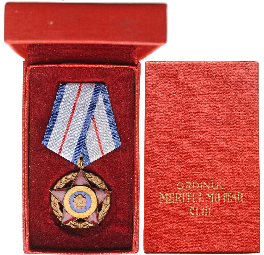 RPR - ORDER OF MILITARY MERIT, instituted in 1954: ROMANIA - POPULAR REPUBLIC, 1948-1965, 1st Model, 3rd Class (1954-1965). Breast Badge, Bronze, 39 mm, center enameled, original suspension ring and ribbon in original case of issue with gilt inscripti