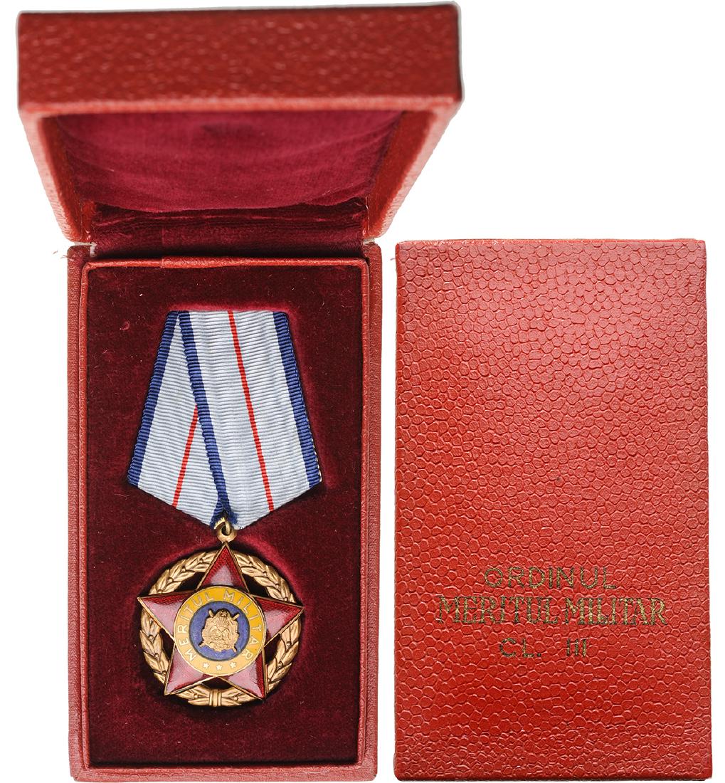 RPR - ORDER OF MILITARY MERIT, instituted in 1954: ROMANIA - POPULAR REPUBLIC, 1948-1965, 1st Model, 3rd Class (1954-1965). Breast Badge, Bronze, 39 mm, center enameled, original suspension ring and ribbon in original case of issue with gilt inscripti