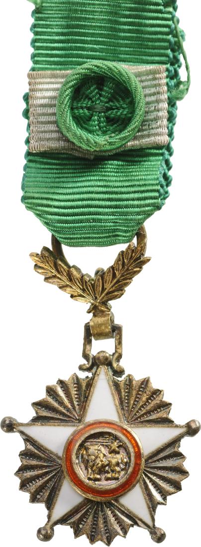 ORDER OF THE LION: SENEGAL, Commander`s Cross Miniature, 3rd Class. Breast Badge, 24x16 mm, gilt Silver, multipart construction, superimposed part gilt, one-side enameled, original suspension laurel, ring and ribbon wit